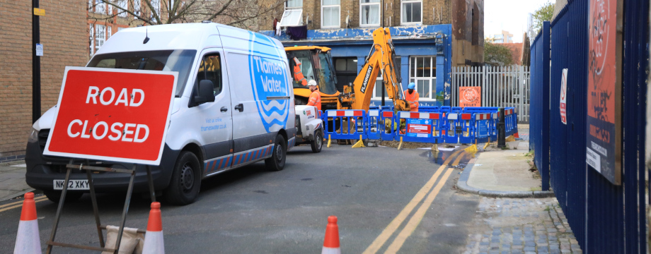 Road closed sign in front of a Thames Water sign