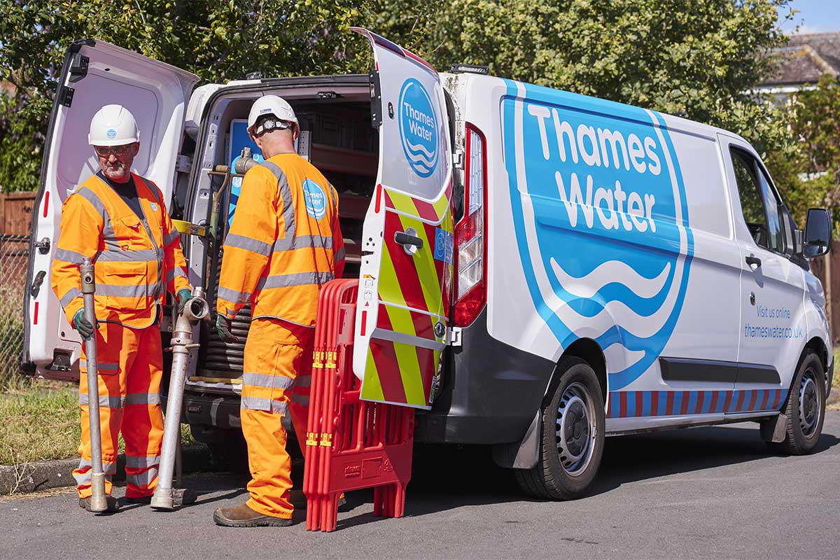 Two engineers at the back of a van