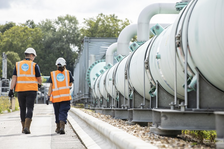 Thames Water staff walking away from the camera on a site